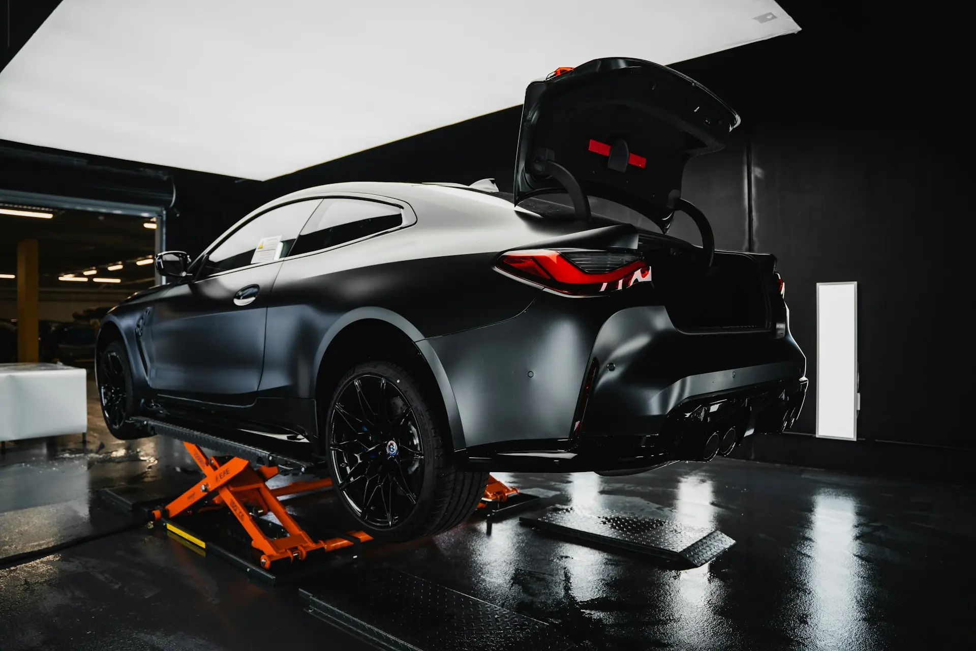 a black sports car with its doors open